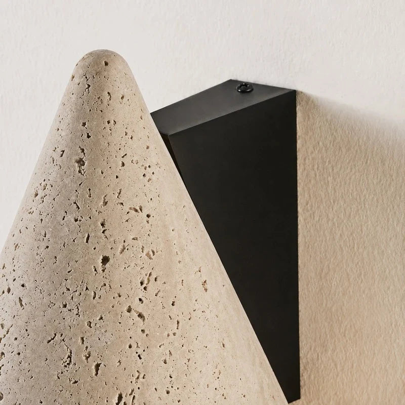 Black wall plate and travertine cone side detail