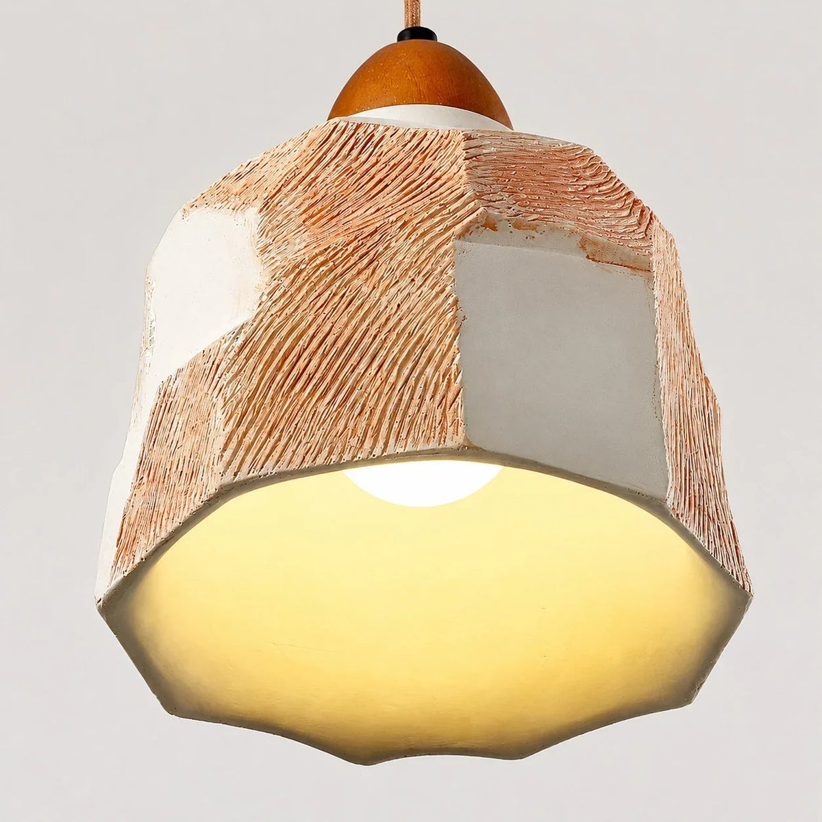 Warm lower glow and faceted shade edge