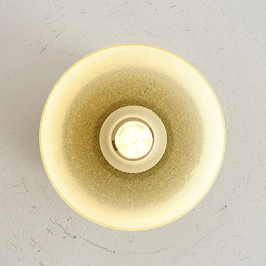 Warm glow detail inside the yellow glass shade