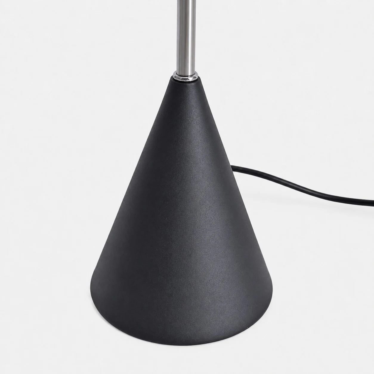 Weighted black cone base and power cord detail