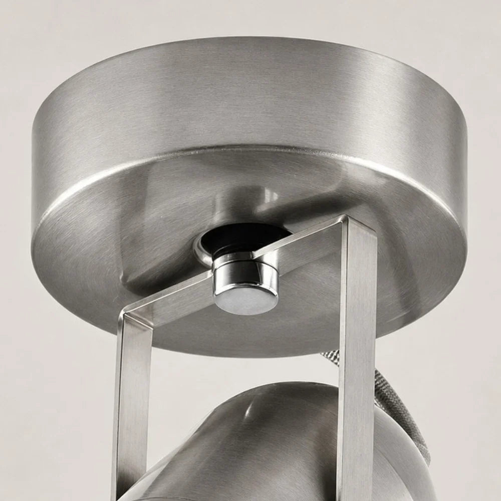 Close view of the round metal mounting base and bracket