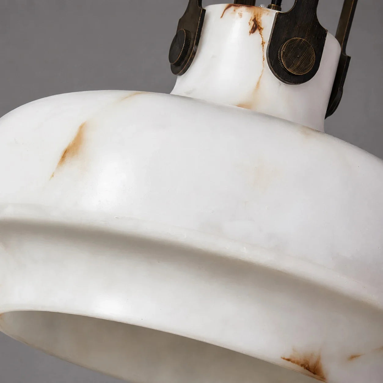 Close view of the softly lit faux alabaster shade