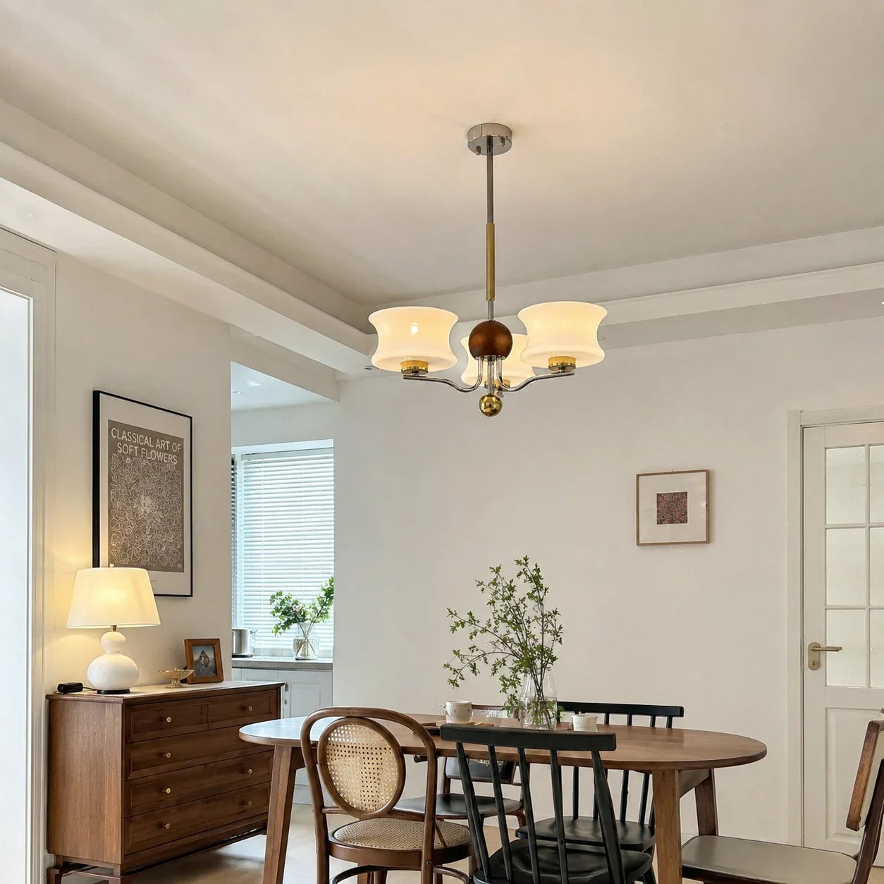 Cream glass chandelier above a round dining table