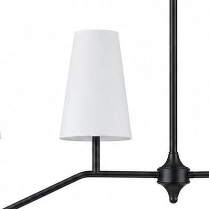Black finish detail near white fabric shade and branch arm