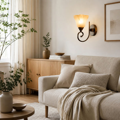 Wall sconce above a cabinet and sofa