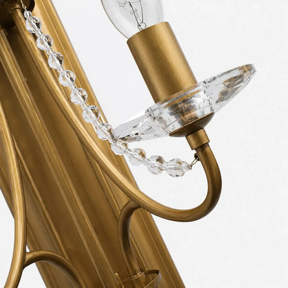 Close view of brass arm, candle cup and crystal chain detail