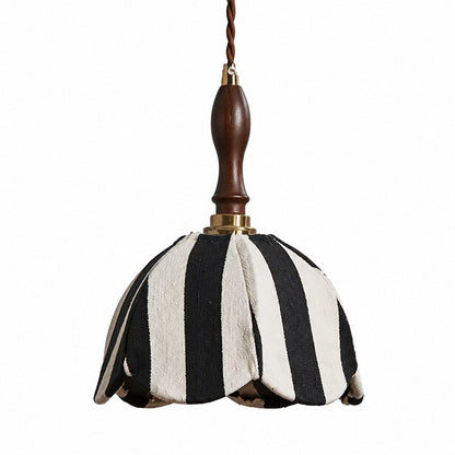 Black and ivory striped fabric pendant lamp with dark wood handle and brass connector