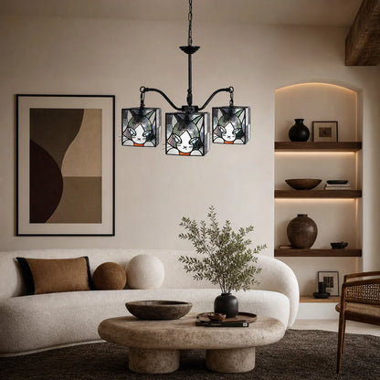 stained glass cat pendant light installed in a warm room
