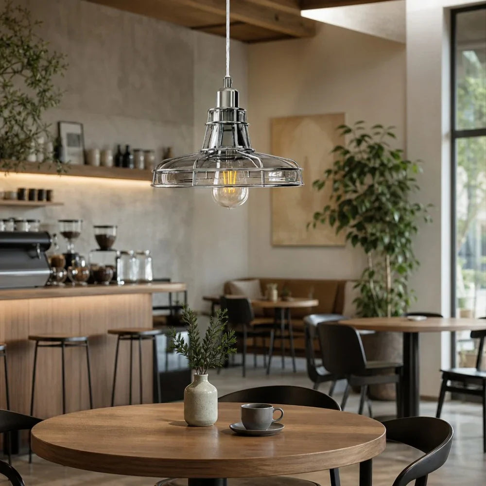 Glass metal cage pendant lamp over dining area