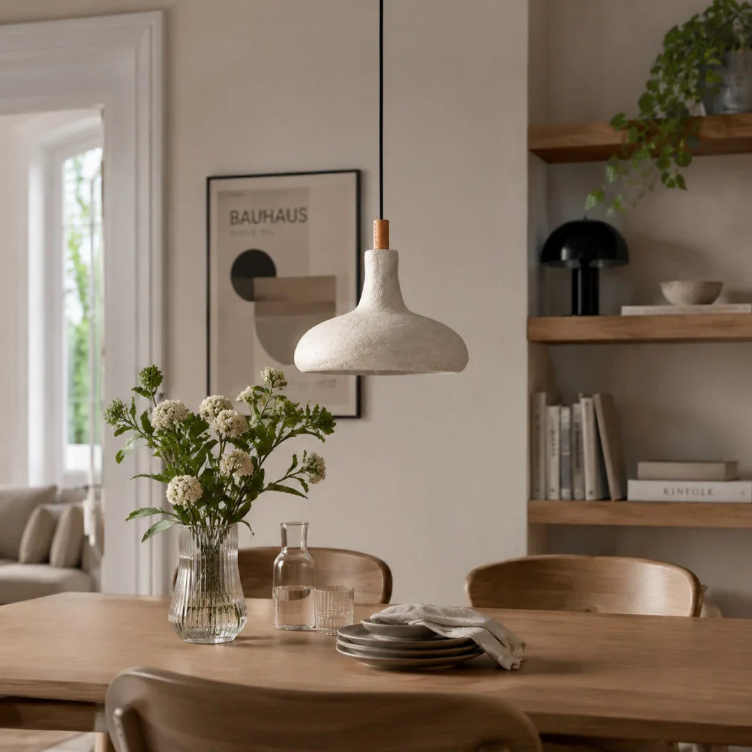 Off-white rice paper pendant lamp above a dining table