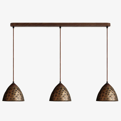 Three-light hammered copper hill pendant on walnut ceiling base