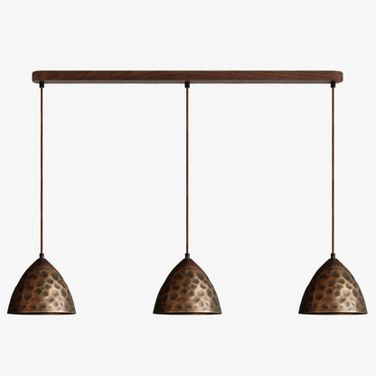 Three-light hammered copper hill pendant on walnut ceiling base