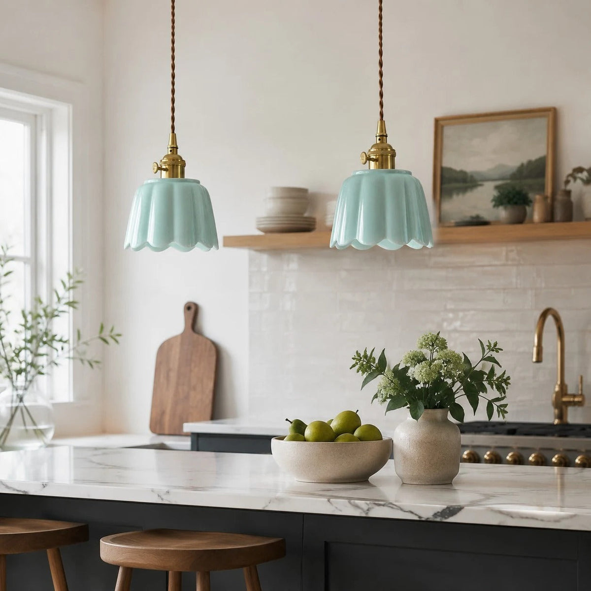 Pair of ceramic lotus pendants over a kitchen island
