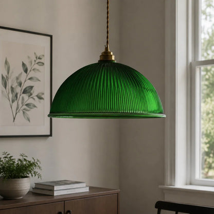 Emerald green pendant light near a bright window