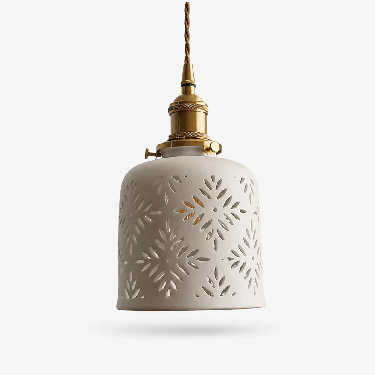 Starflower cutout ceramic pendant light with brass hardware