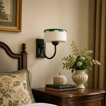 Bedside scale scene with wall-mounted sconce