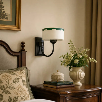 Bedside scale scene with wall-mounted sconce