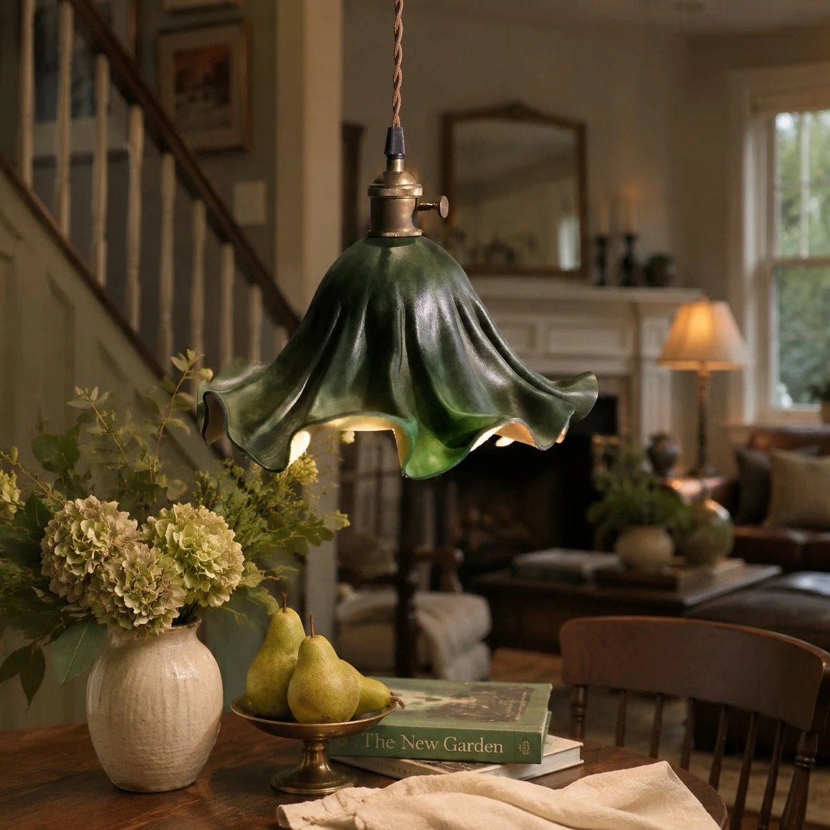 Dark green leather pendant light in a styled interior