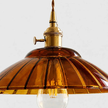 Amber ribbed glass shade and bulb detail