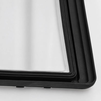 Close-up of black frame and white glass shade