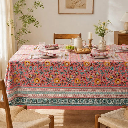 Pink garden border tablecloth styled with tableware