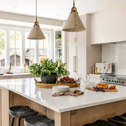 Leather pendant lights above a kitchen island