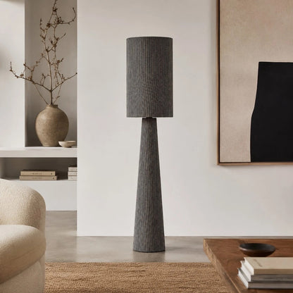 Tall gray striped floor lamp in a modern neutral room