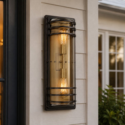 Large bronze glass outdoor wall sconce installed on a porch wall