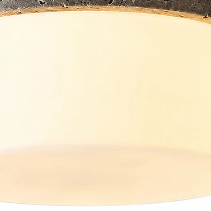 Close detail of warm glass shade and soft diffuser glow