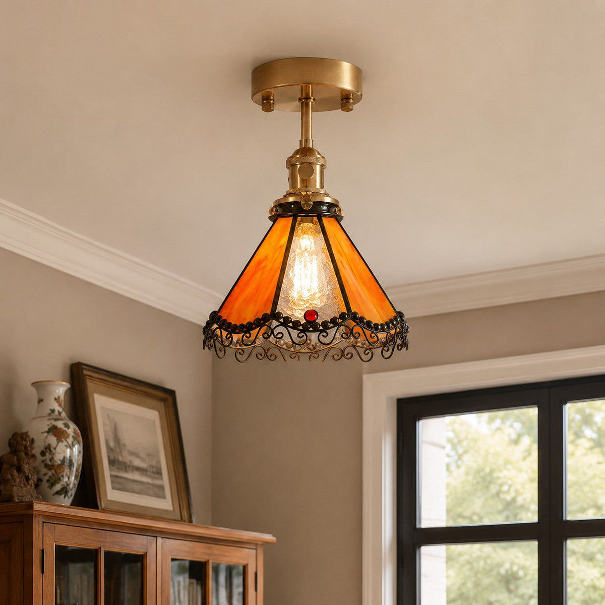 Orange stained glass ceiling light above a cabinet corner