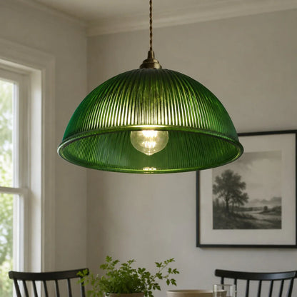 Emerald green ribbed glass pendant close view in a dining room