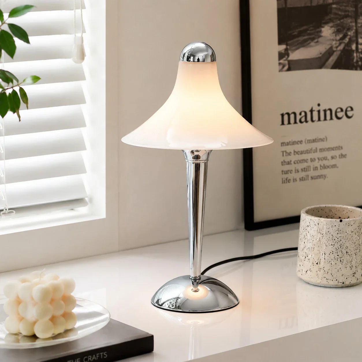 White table lamp beside a window