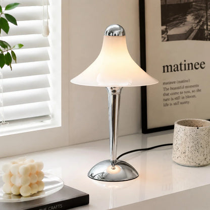 White table lamp beside a window