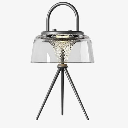 Clear solar garden lantern with black handle and tripod legs