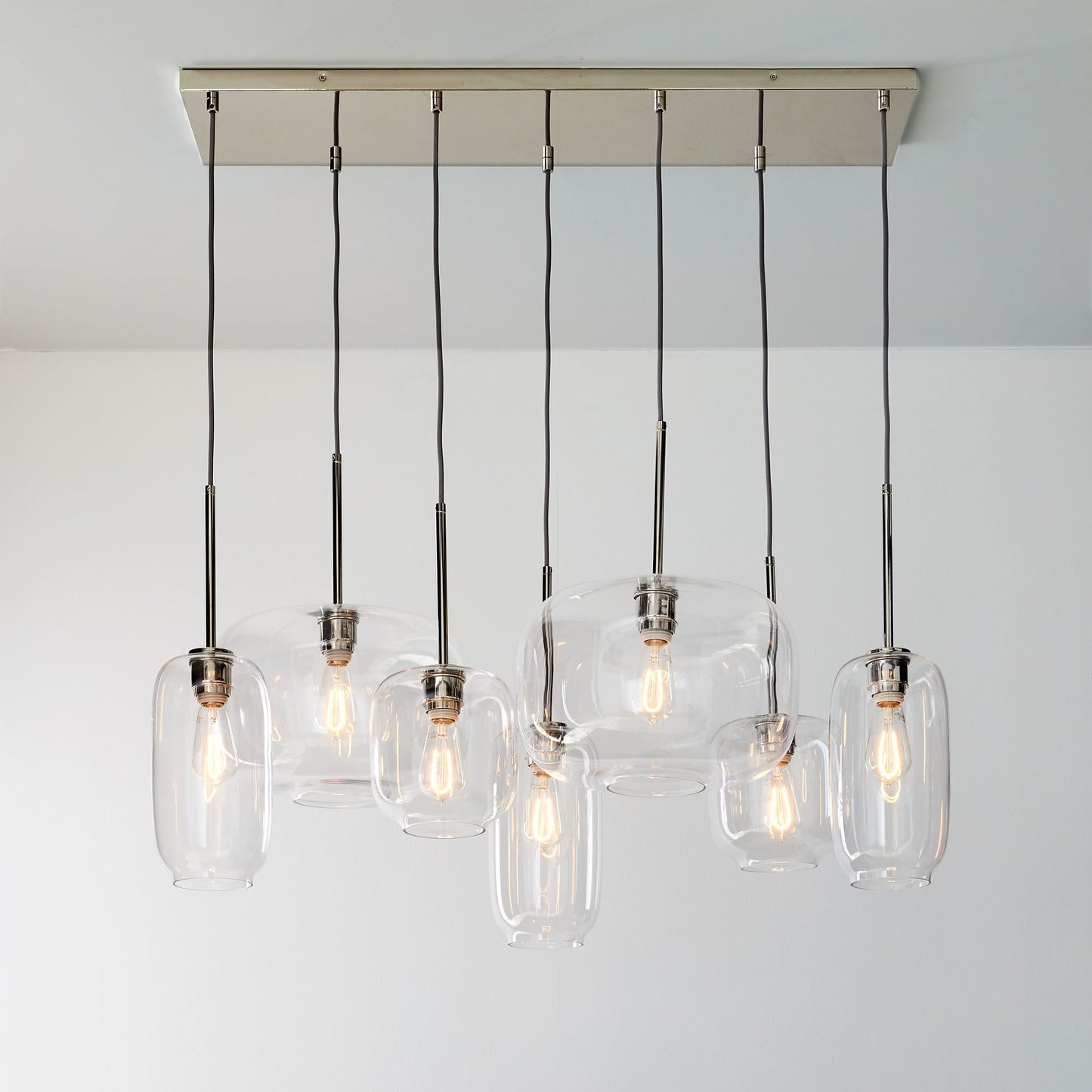 Lumivelle Sculptural 7-Light Chandelier – Adjustable Height Modern Glass Pendant