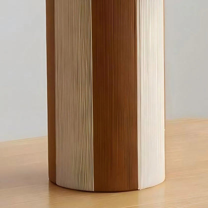 Cylindrical striped table lamp base with woven panel texture