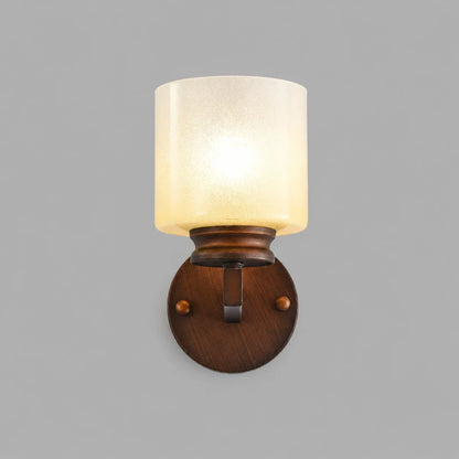 Front view of lit aged bronze alabaster glass wall sconce