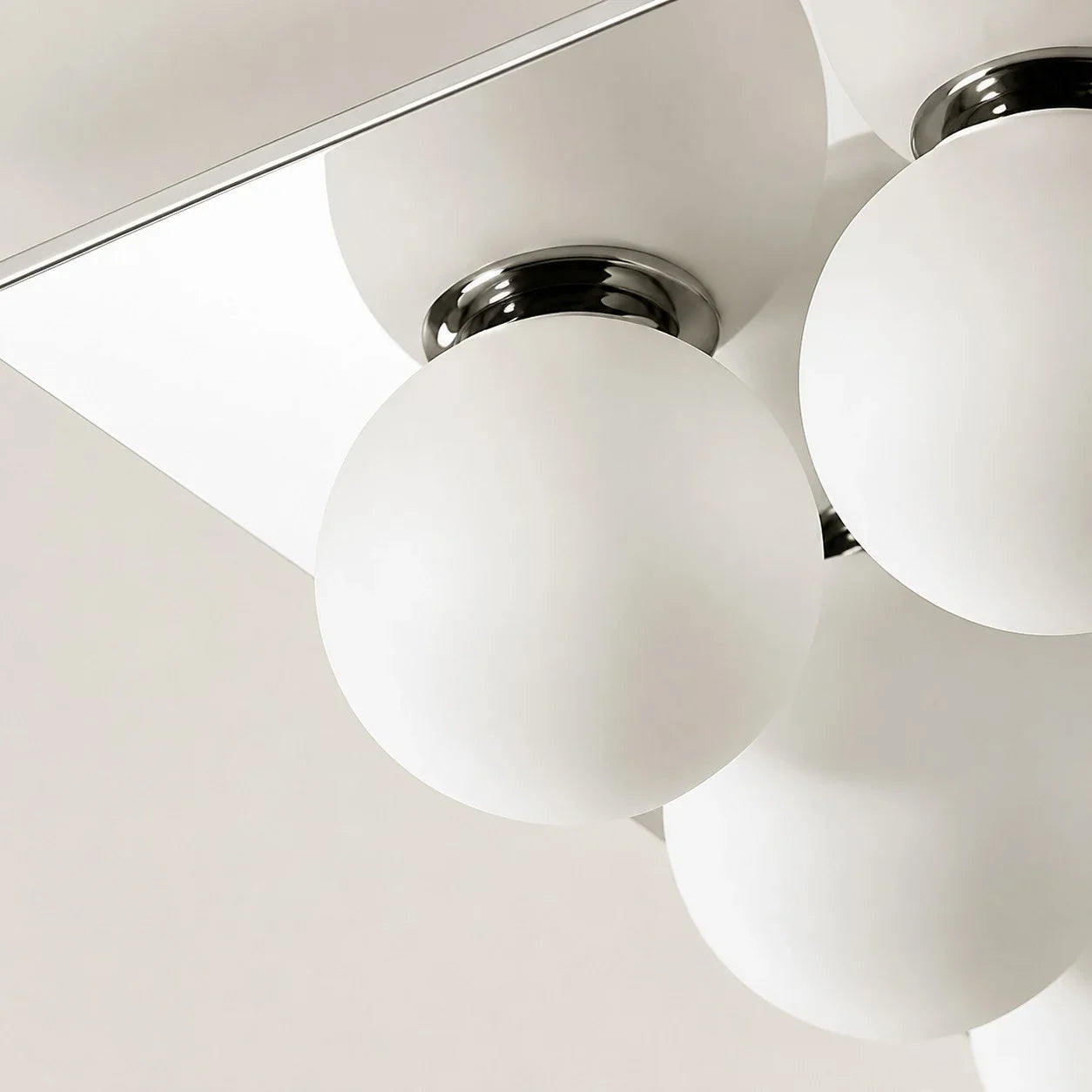 Detail image: close view of chrome fitting and glass diffuser.