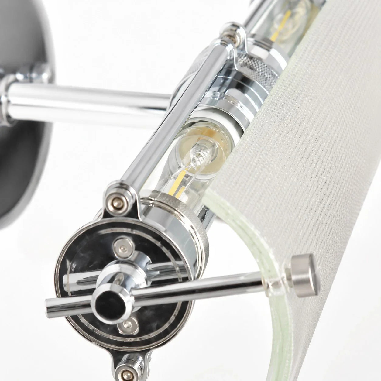 Close detail of the ribbed glass shade and metal bracket