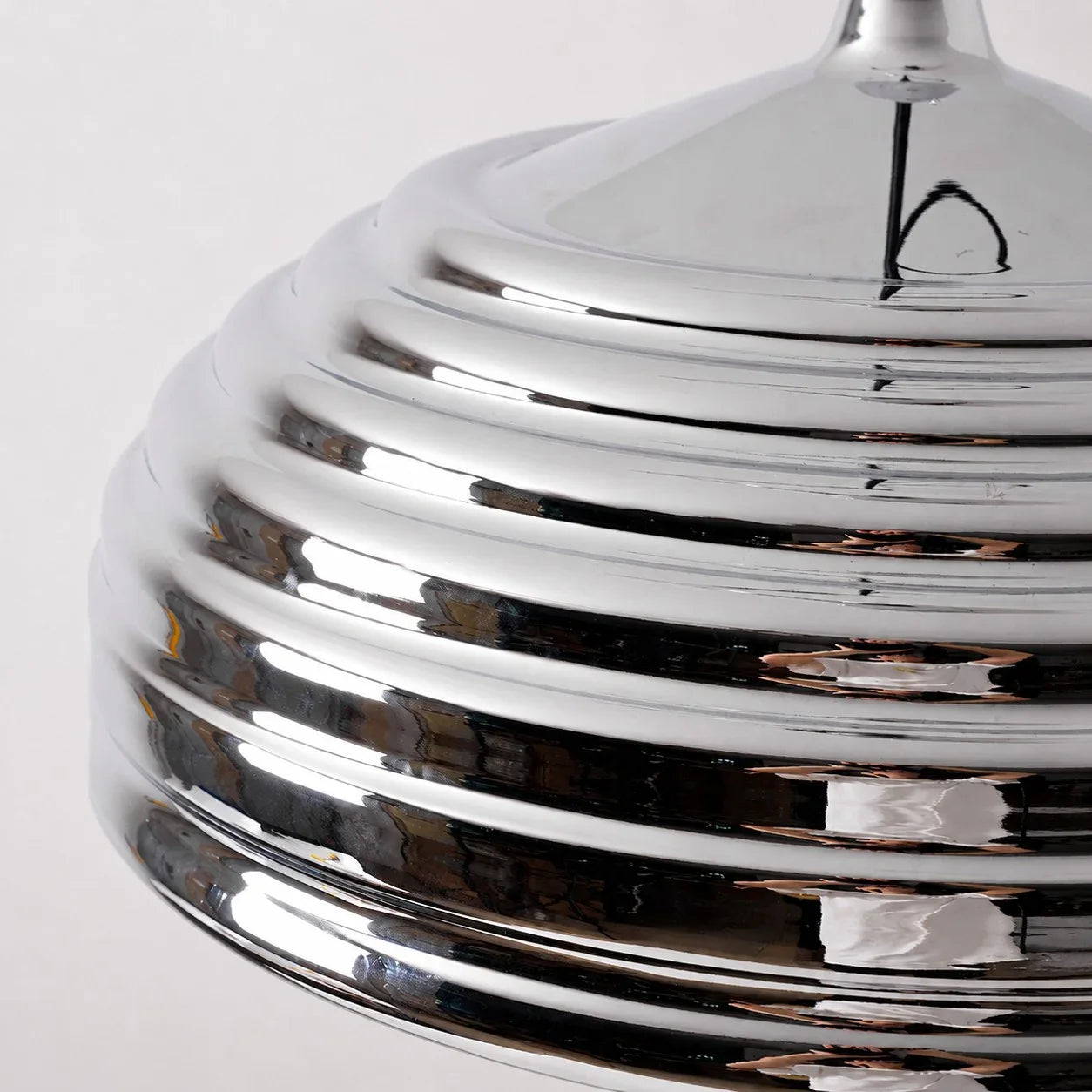 Close view of the ribbed polished chrome dome shade
