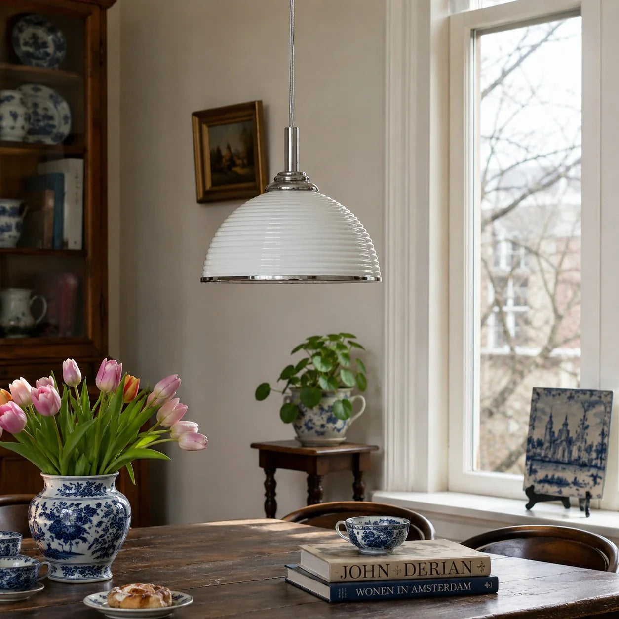 White ribbed pendant light in a bright dining room
