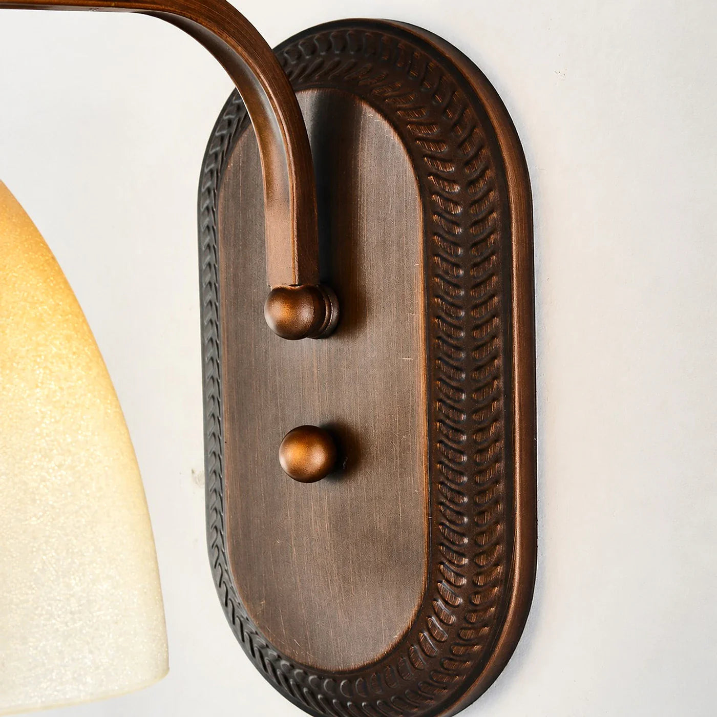 Antique bronze amber glass wall sconce