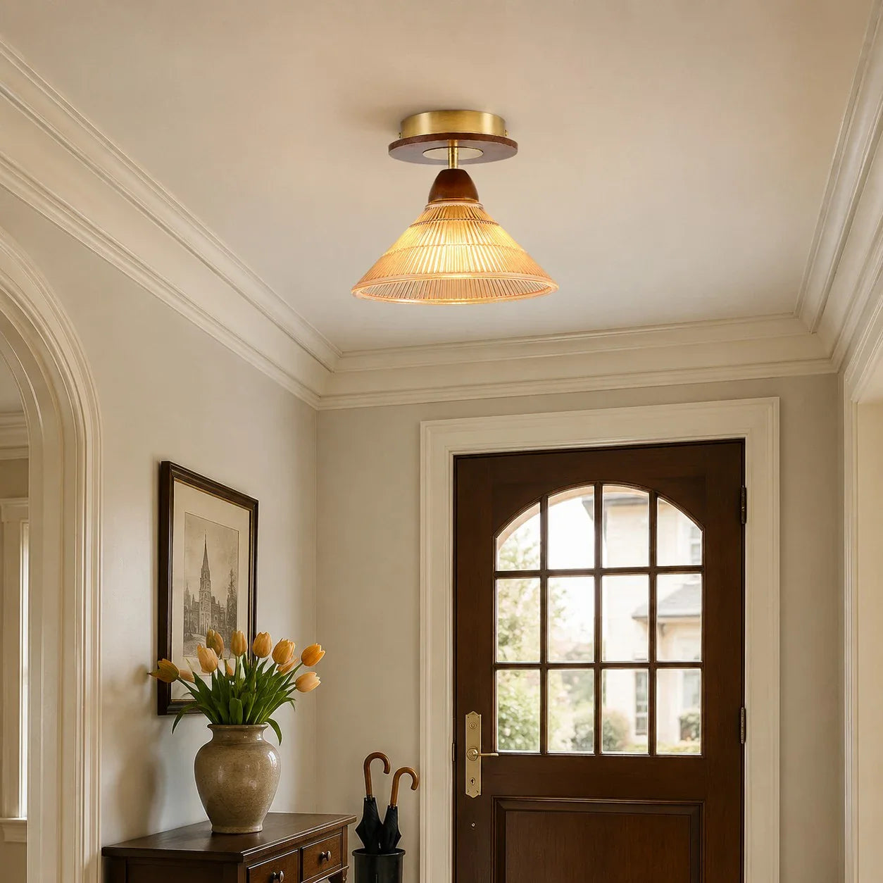 Amber flush mount ceiling light near an arched doorway