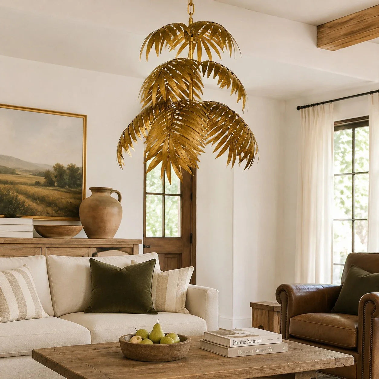 Gold palm leaf chandelier in a warm living room