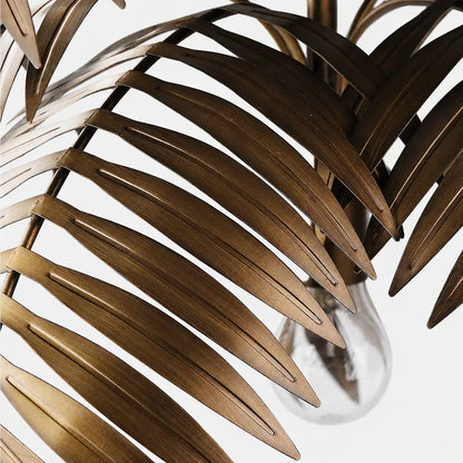 Close view of cut metal leaf edges and layered chandelier structure