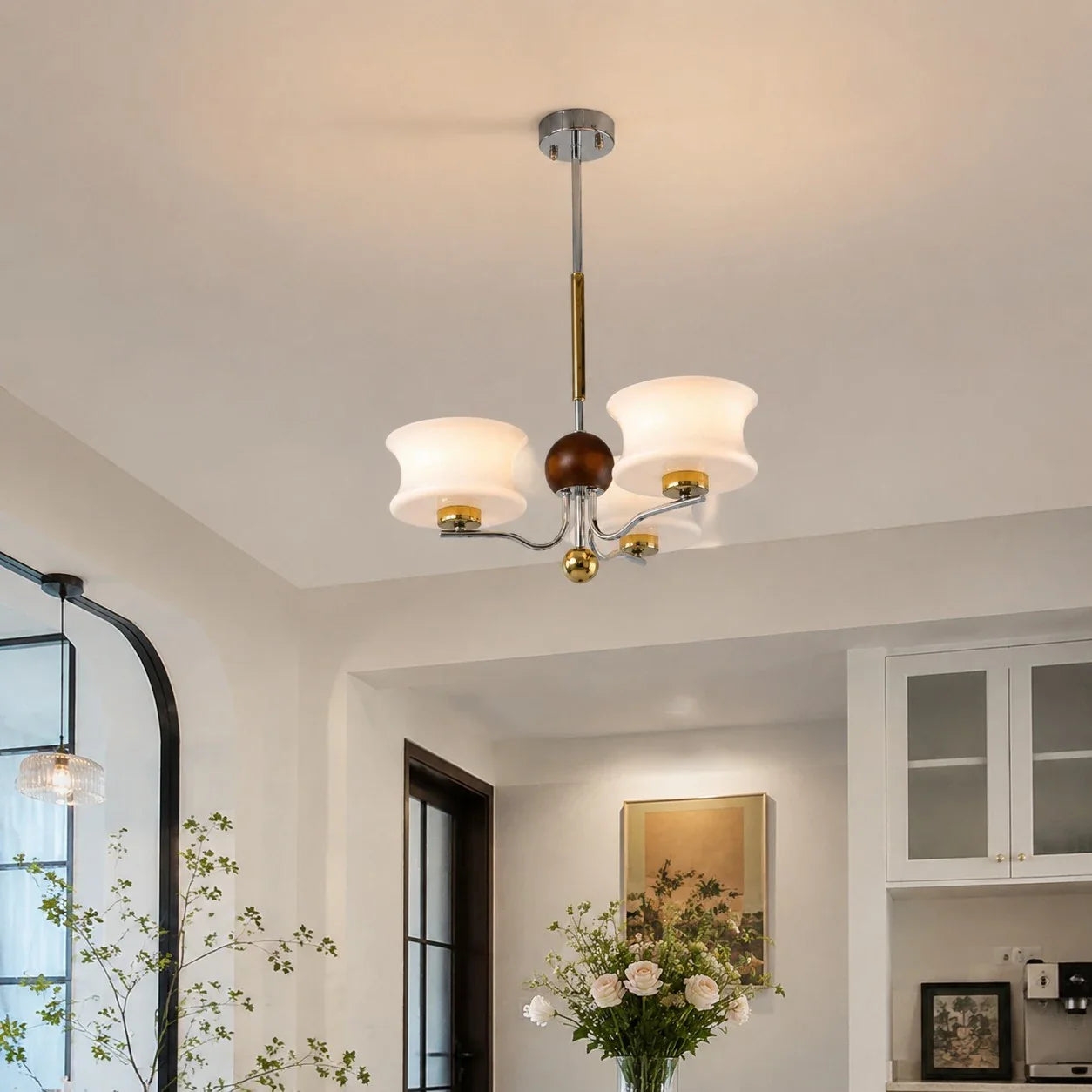 White glass chandelier mounted close to the ceiling