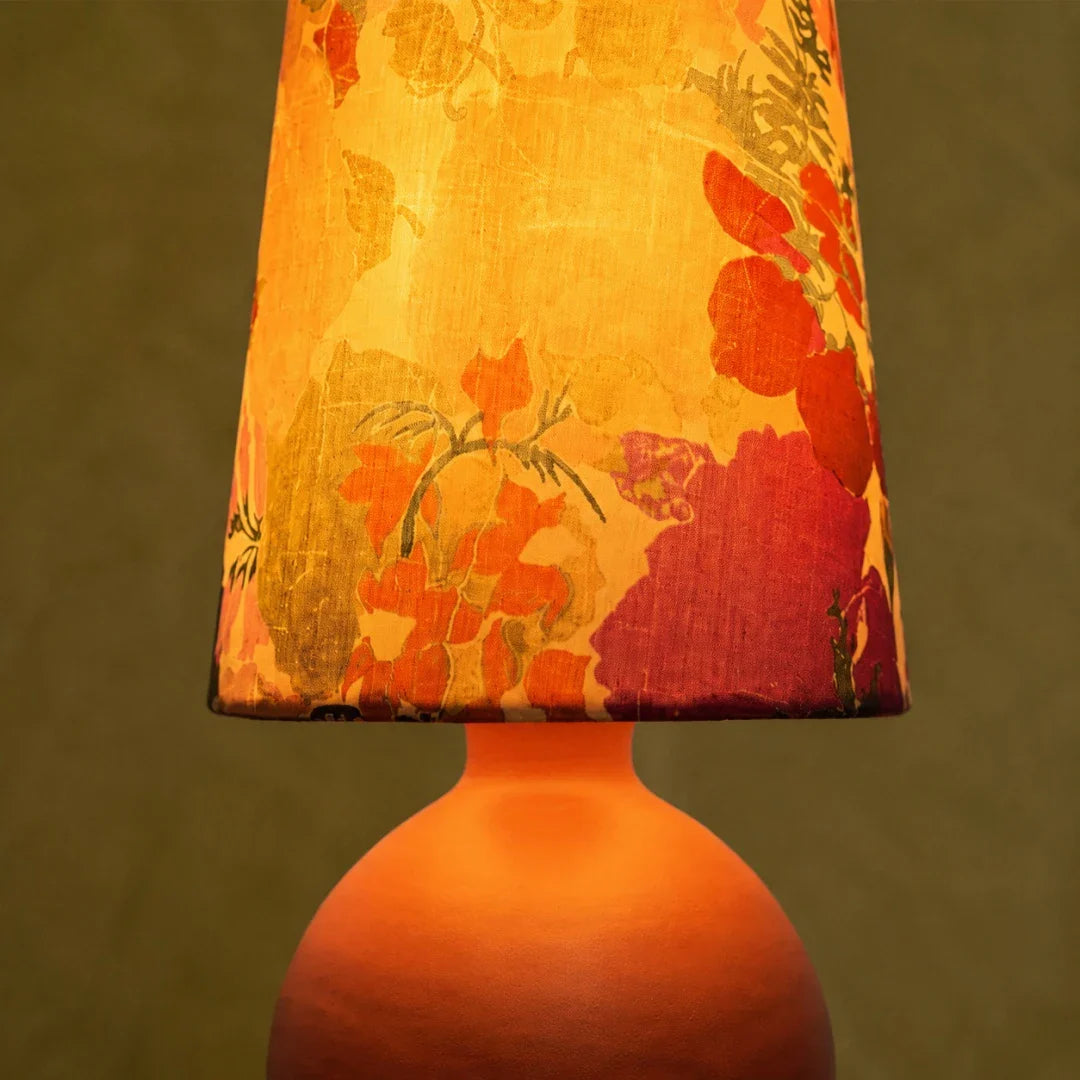 orange round base table lamp