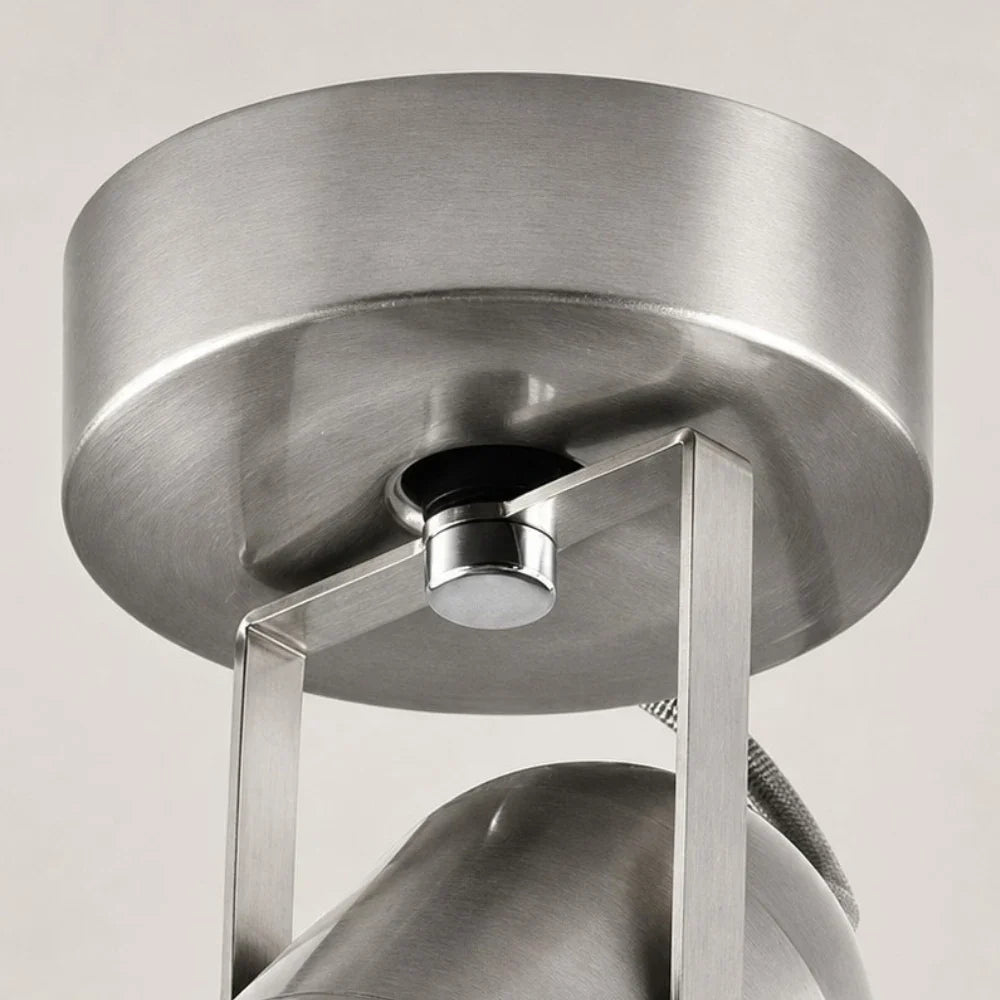 Close view of the round metal mounting base and bracket