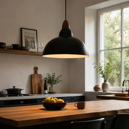 black pendant light over a warm kitchen worktop