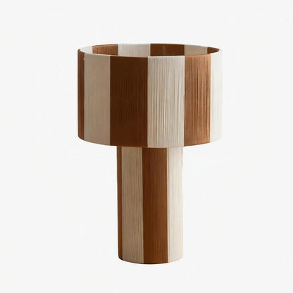 Coffee and white striped woven shade table lamp on a white background
